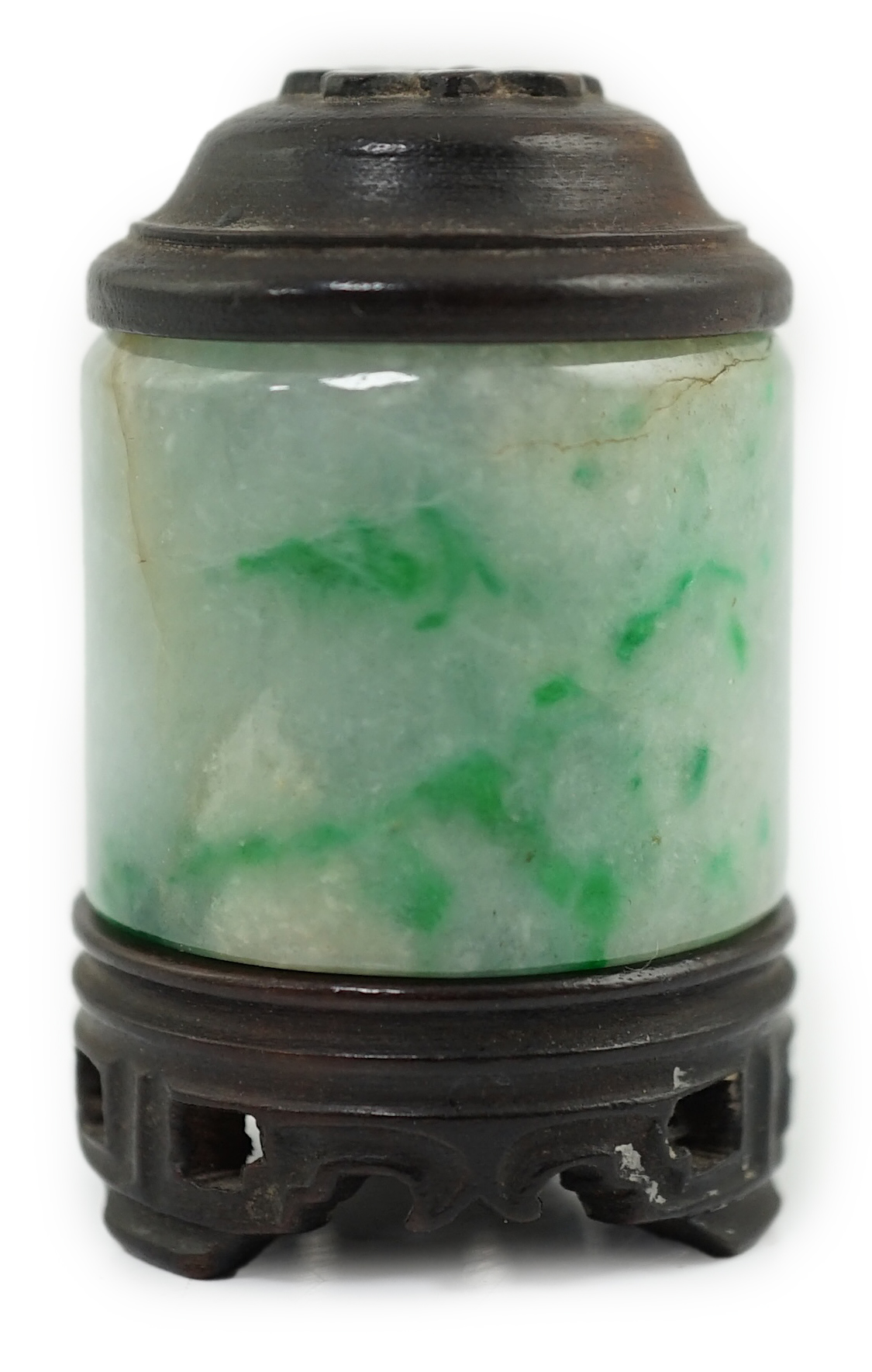 A Chinese jadeite archer's thumb ring, wood stand and cover, 19th century